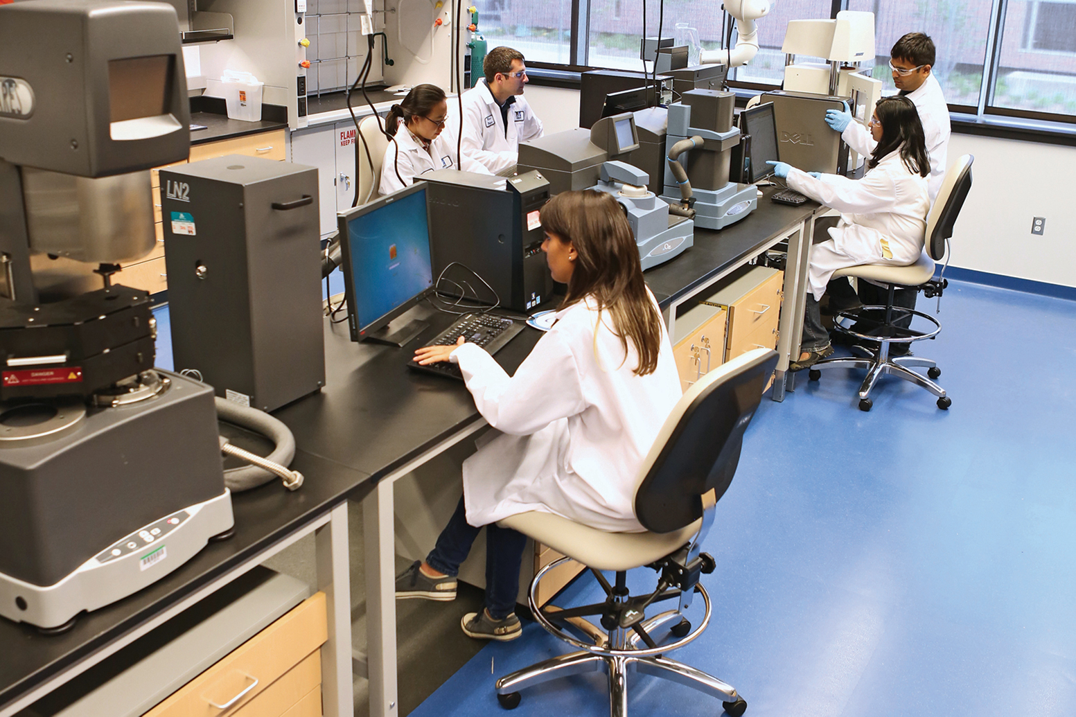 Researchers work in lab