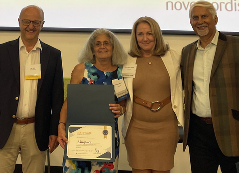Accepting the award for Best Startup at Massachusetts Life Sciences Innovation Day on July 21 are Institute for Applied Life Sciences startup 3Daughters’ Chief Business Officer Shelley Amster (holding certificate) and CEO Mary Beth Cicero. Also pictured are Uli Stilz (left), vice president of Novo Nordisk Bio Innovation Hub, and Vinit Nijhawan, vice chair and managing director of MassVentures.