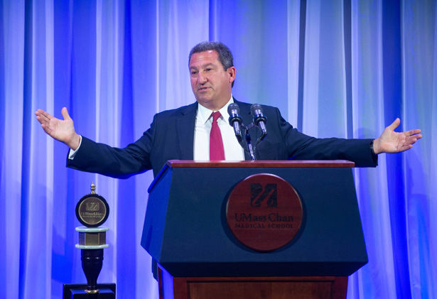 Robert Manning addresses the audience in the Albert Sherman Center auditorium.