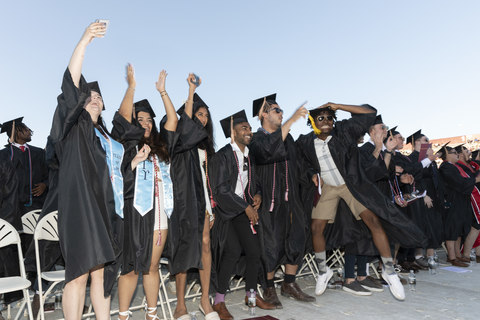 A group of excited students at UMass Amherst 2022 commencement ceremony