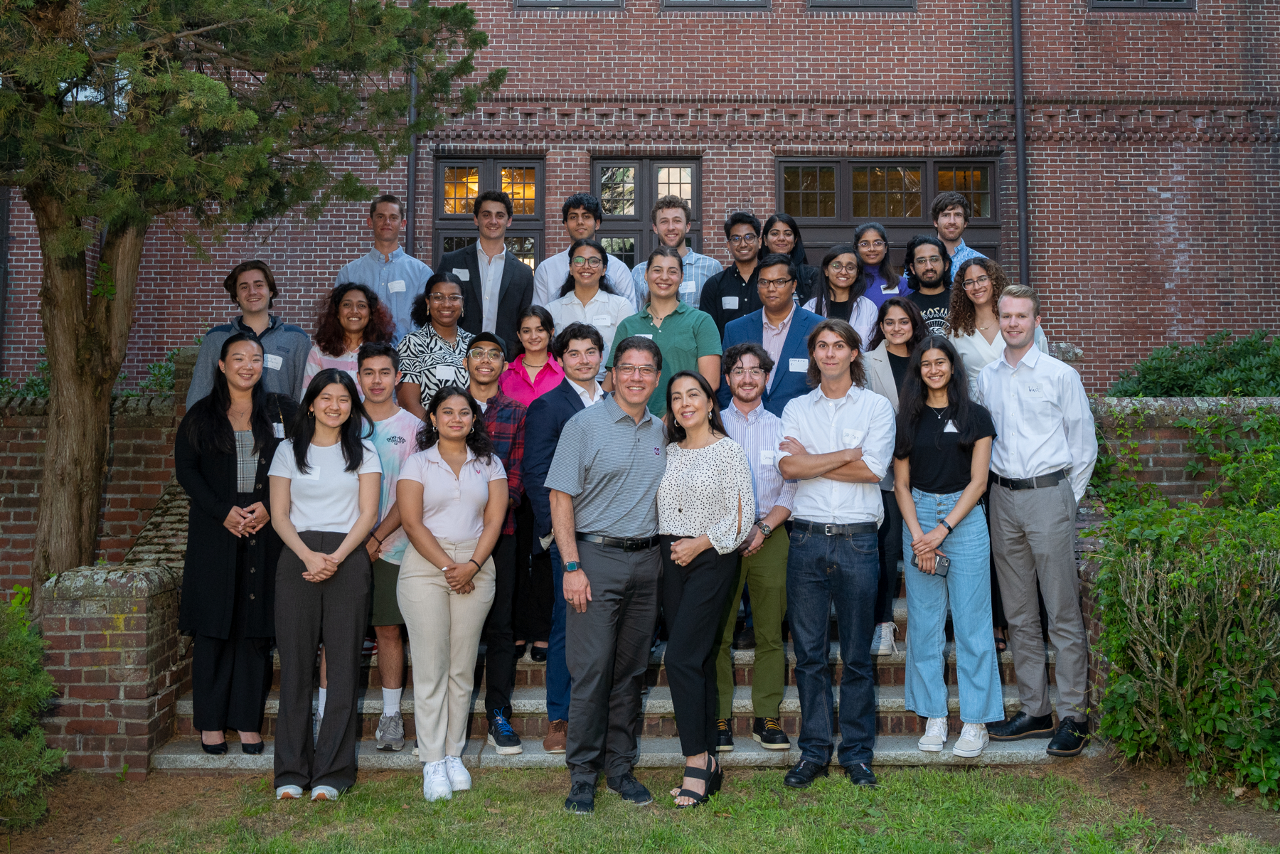 Mount ida of UMass Amherst summer interns posing for picture with chancellor Reyes and wife Maritza.