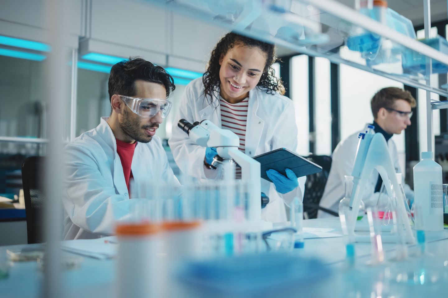 Stock photo of a man and woman working together in a research lab.
