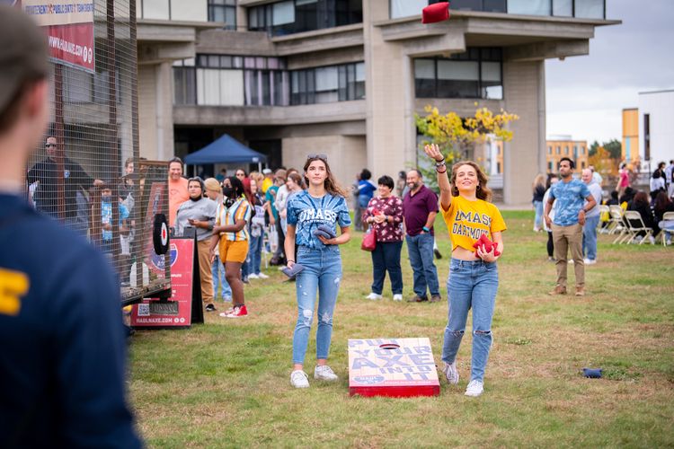 Students play cornhole during Blue & Gold Festival at UMass Dartmouth
