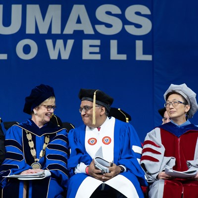 Chancellor Jacquie Moloney, Dr. Ashish Jha and Vice Chancellor Julie Chen share the Commencement stage during the morning undergraduate ceremony.