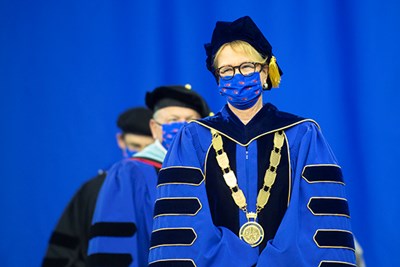 Chancellor Jacquie Moloney processes into the Tsongas Center for Commencement 2021.