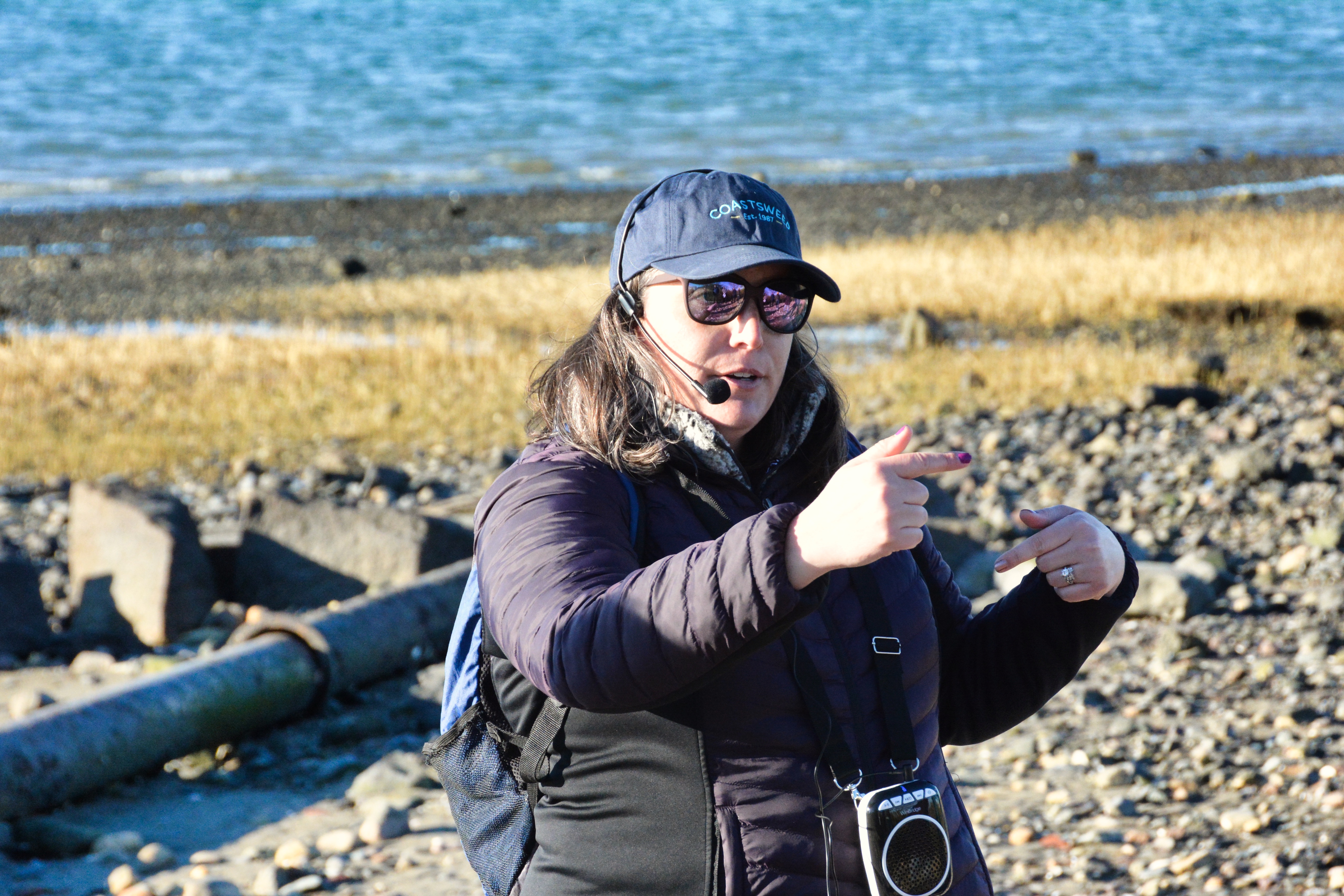 A presenter talks to attendees about the shoreline restoration at Coughlin Park. 