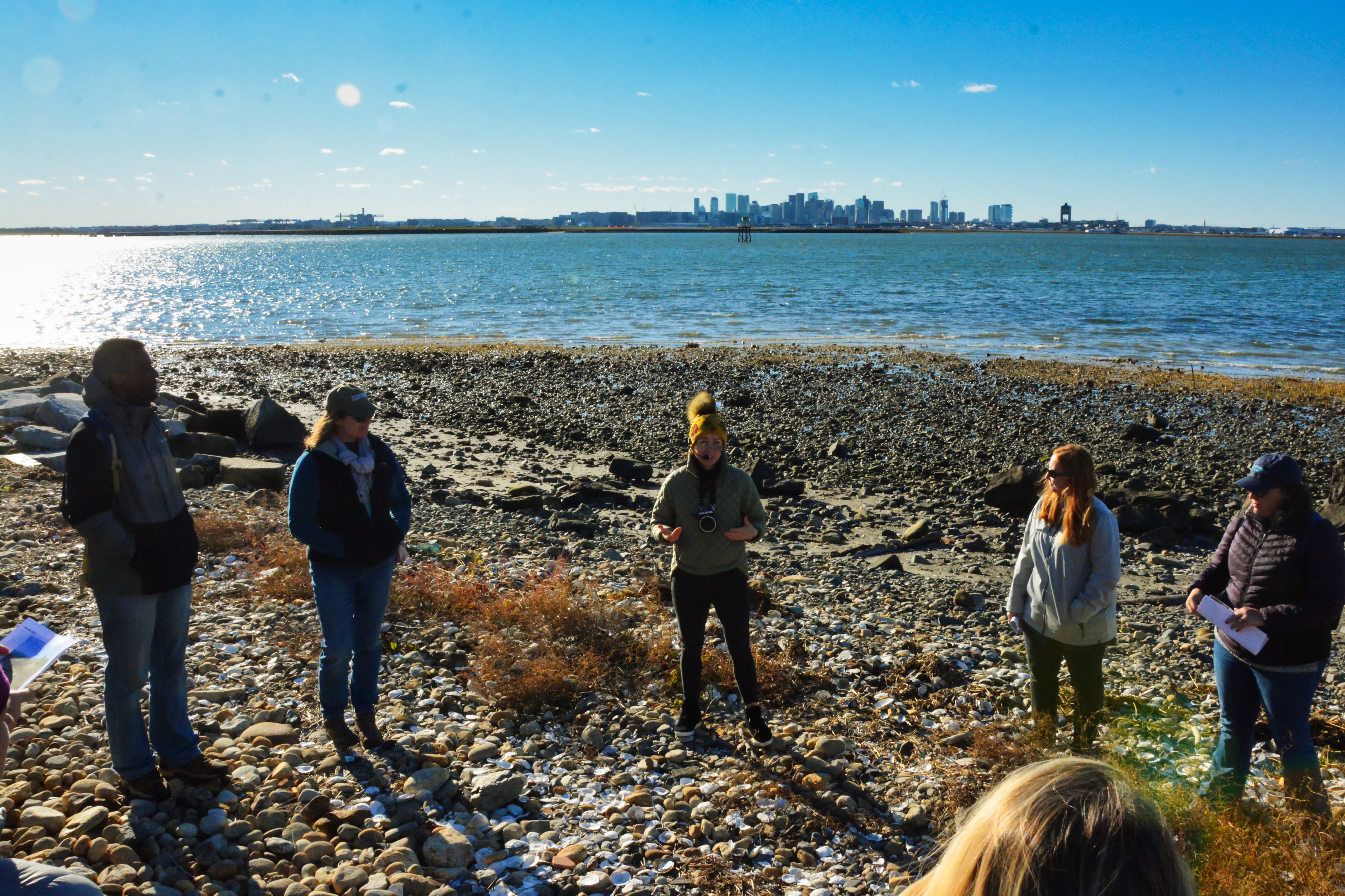Participants learn about a shoreline restoration project at Coughlin Park in Winthrop during a conference field trip. The project was completed by the Woods Hole Group and is being monitored by the Stone Living Lab team.