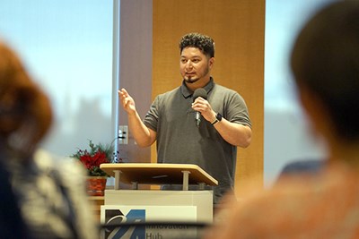 Mechanical engineering alum Jonathan Aguilar '21, project manager at CADSPARC, pitches his 3D printing project during the Digital Equity Challenge at UMass Lowell's Innovation Hub in Haverhill.