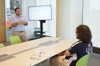 Blue Crew President Enzo Biagini listens in as SA&L Assistant Director Michael Kennedy talks about civic engagement.