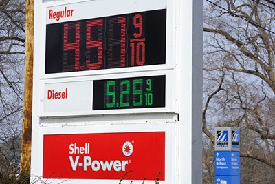 Gas prices listed on a Shell station sign