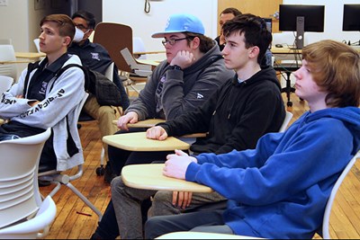 High school students sit in classroom during GenCyber program