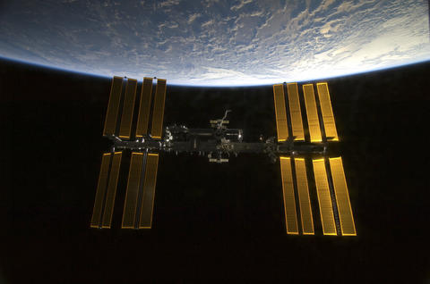 The International Space Station with the Earth in the background.