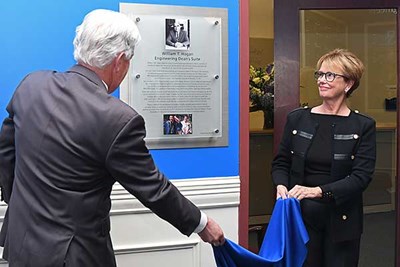 UMass President Marty Meehan and Chancellor Jacquie Moloney unveil a plaque at the dedication of the William T. Hogan Engineering Dean’s Suite in honor of the university’s former chancellor.