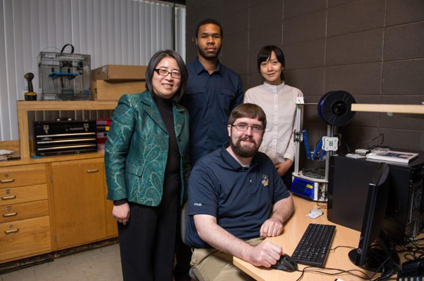 Dr. Hong Liu, Professor of Electrical and Computer Engineering at UMass Dartmouth, in the lab with graduate students.