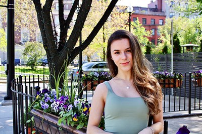 Honors nursing student Isabella De Souza stands outside