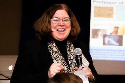 Professor Emerita of Criminology and Justice Studies Linda Williams addresses faculty at a research forum.