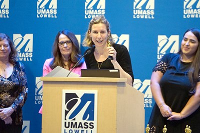 Giulia Po DeLisle, associate teaching professor in the Department of World Languages and Cultures, accepts her OERscar award at the second-annual ceremony, held recently at Moloney Hall.