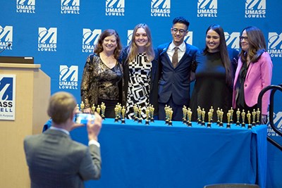 Provost Joseph Hartman takes a photo of, from left, Julie Nash, Ashley Greene, Neyder Fernandez, Valeria Saldana and Donna Mellen during the OERscars ceremony.