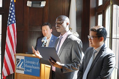 Energy engineering Ph.D. students Benard Tabu, center, and Visal Veng accept an $8,000 S.E.E.D. Fund grant for their Green Fertilizer project while Rist Institute for Sustainability & Energy Executive Director Ruairi O'Mahony looks on at Allen House.