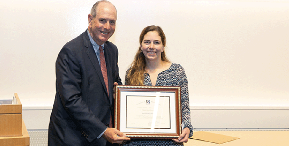 Chancellor Collins presents the 2021 Chancellor’s Award to Heather Loring for outstanding research and leadership.