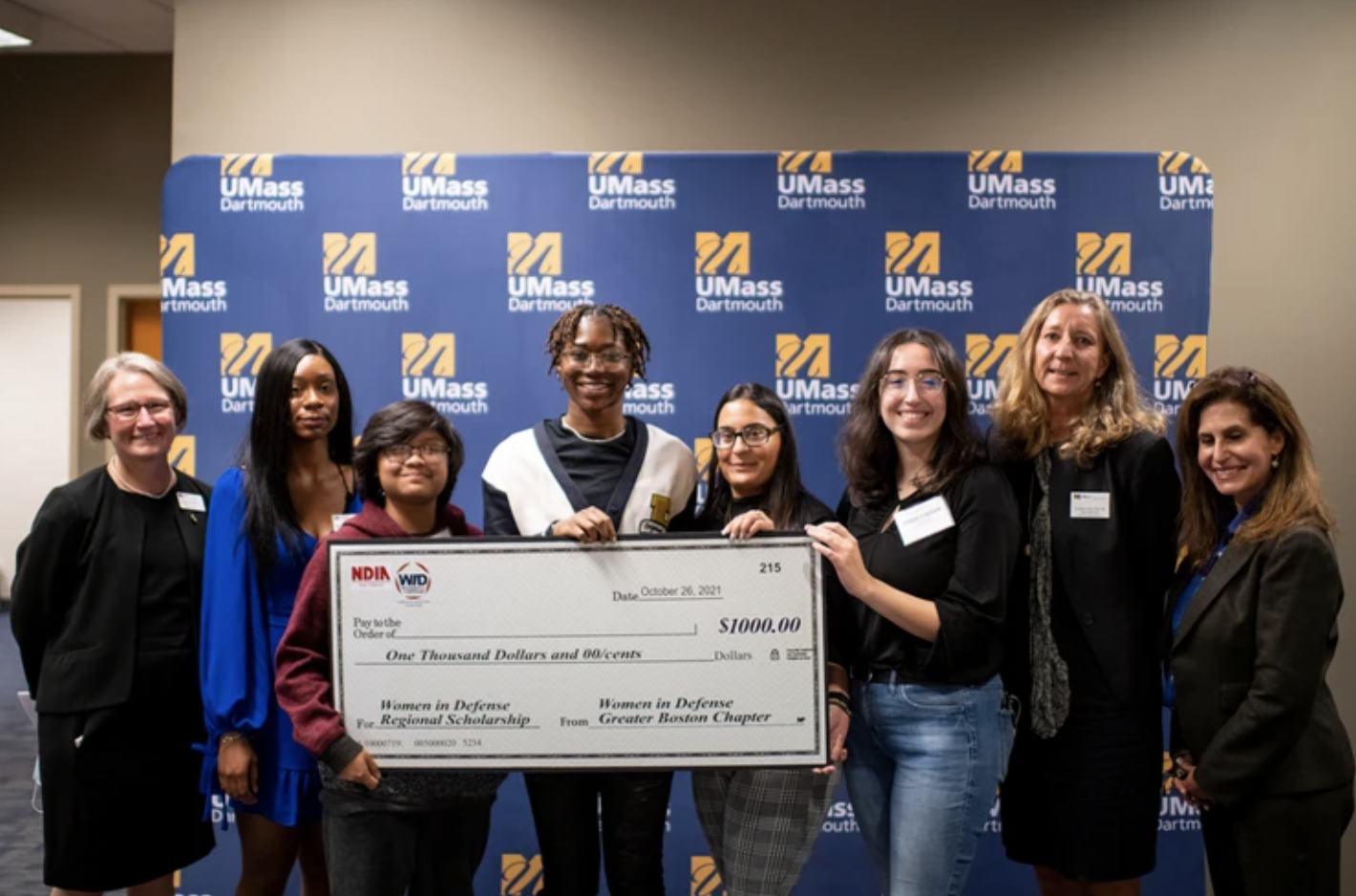 Left to right: Dean Jean VanderGheyst, UMassD College of Engineering & WID—GBC scholarship recipients Raena Gaston, Kelley Chanaphay, Lois Konadu, Tabitha Aguiar, and Erika Caushi; Diane Phillips (vice president of Boston Operations for JRAD), and Karen Krause-Bencal (managing director of K2C Ventures).