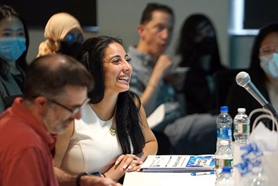 Sensor Challenge judge Rajia Abdelaziz '16 smiles while questioning a contestant about their startup.