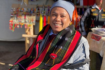 2022 Greeley Scholar for Peace Studies, Soe Mying, sits and smiles at camera