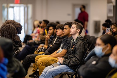 Students from four area high schools listen to a brief overview of UMass Lowell's admissions process.