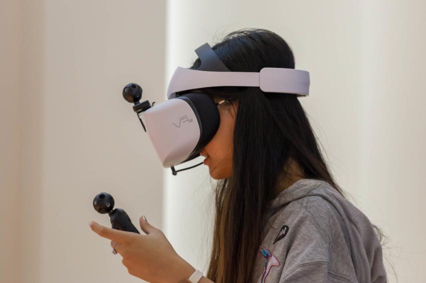 Young woman with virtual reality headset