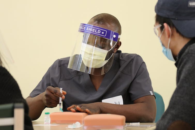 Medical students practice vaccination methods at the University of Massachusetts Medical School. 