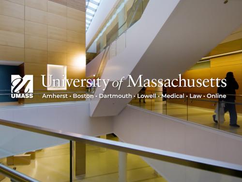 UMass logo overlaid on interior view of UMass Medical School