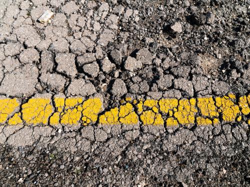 Close up of cracked highway road