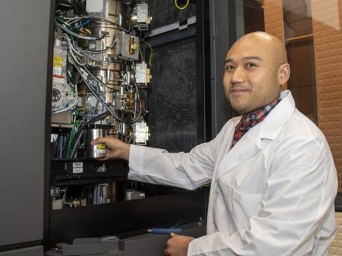 A male researcher works in the Mass. Cryo-Electron Microscopy facility at UMass Medical School-Worcester