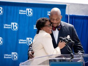 Dr. J Keith and Angela Motley Hugging at the Dedication of UMass Boston Residence Halls