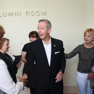 U.S. Rep. Stephen Lynch shakes hands with faculty. Image by: Harry Brett