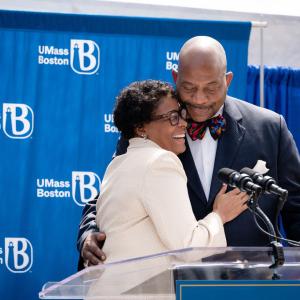 Dr. J Keith and Angela Motley Hugging at the Dedication of UMass Boston Residence Halls