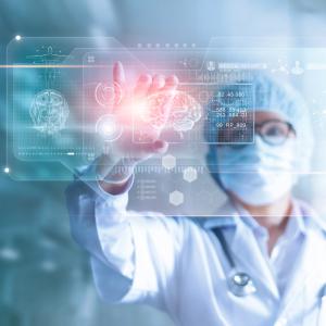 Doctor, surgeon analyzing patient brain testing result and human anatomy on technology