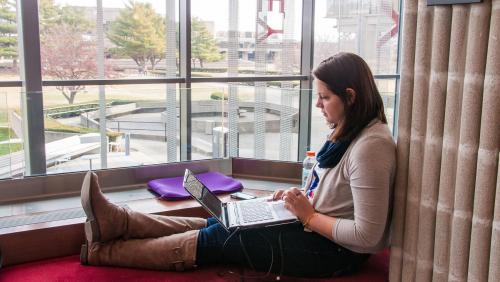 Student works on laptop