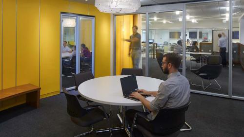A student works in a room in the UMass Boston Venture Development Center