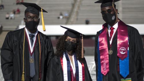Three students at the UMass Amherst commencement ceremony
