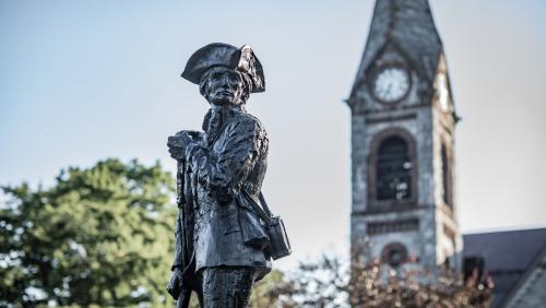 UMass Amherst photo with the Minuteman statue and the Old Chapel in the background