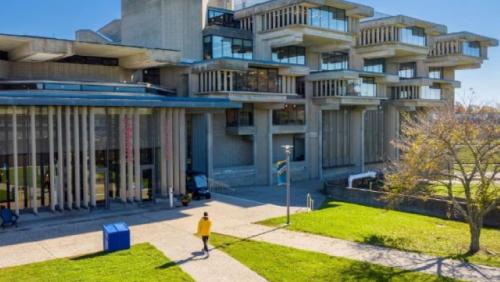 Photo of students walking around the LARTS building on the UMass Dartmouth Campus. 